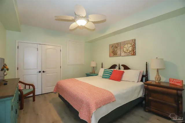 a bed room with a bed and a chandelier