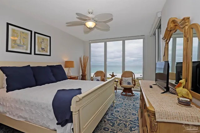 a bathroom with a sink a toilet and shower curtain