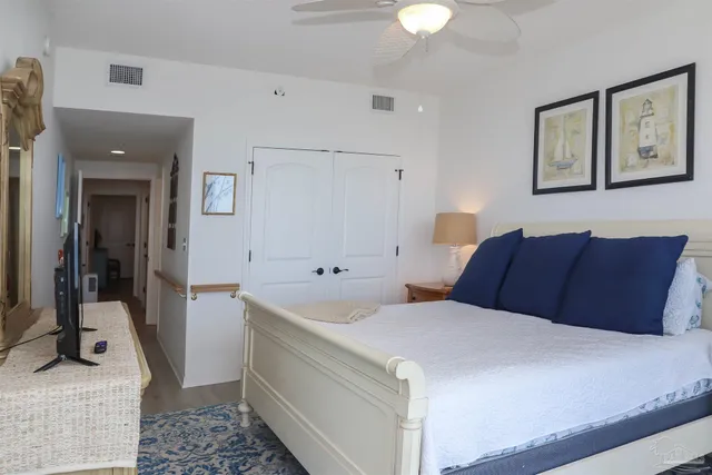 a view of a dining room with furniture a chandelier and wooden floor