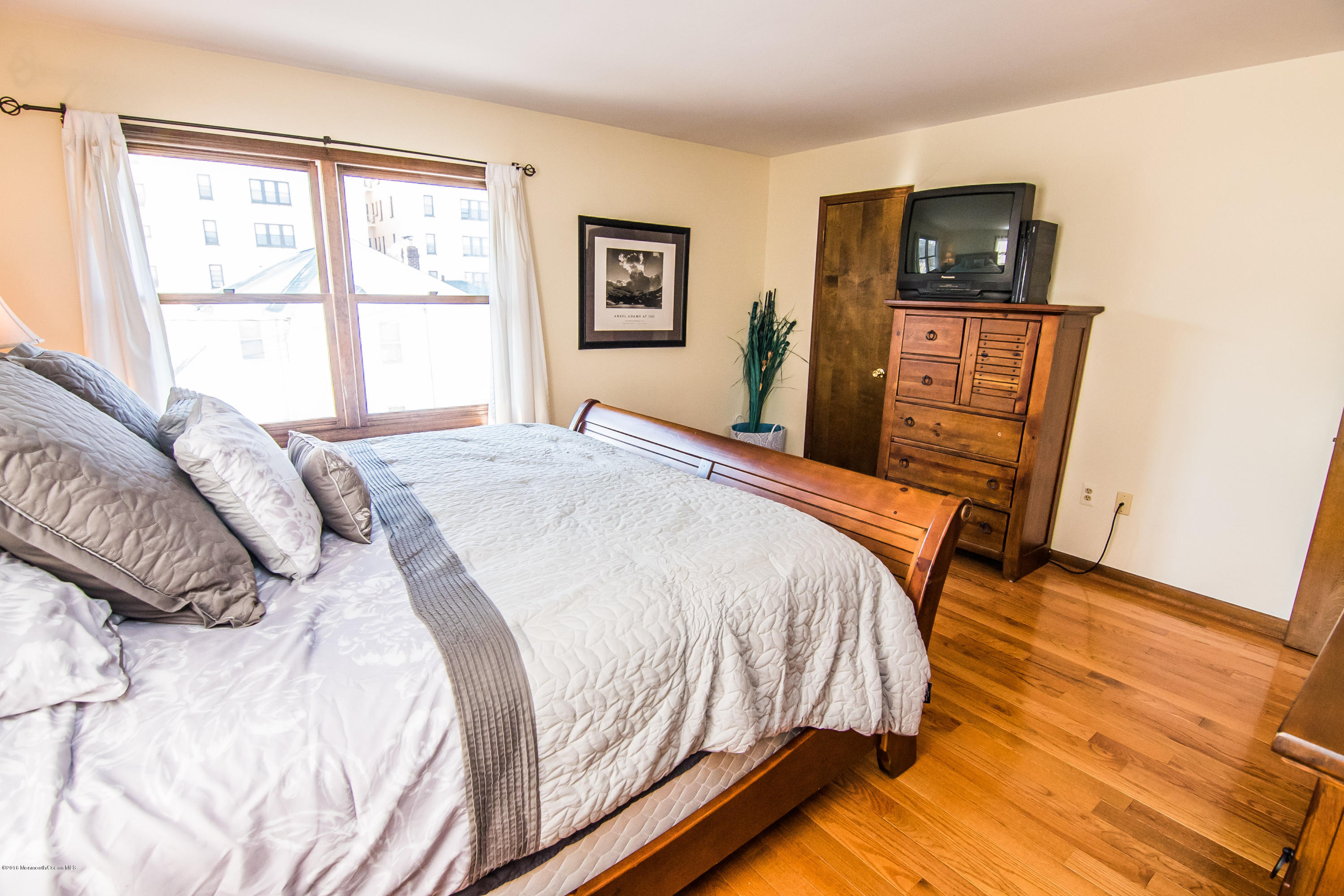 20 Pinckney Road, Unit A1 Red Bank, NJ 07701 - Photo 16 of 25 a bedroom with a bed and a television
