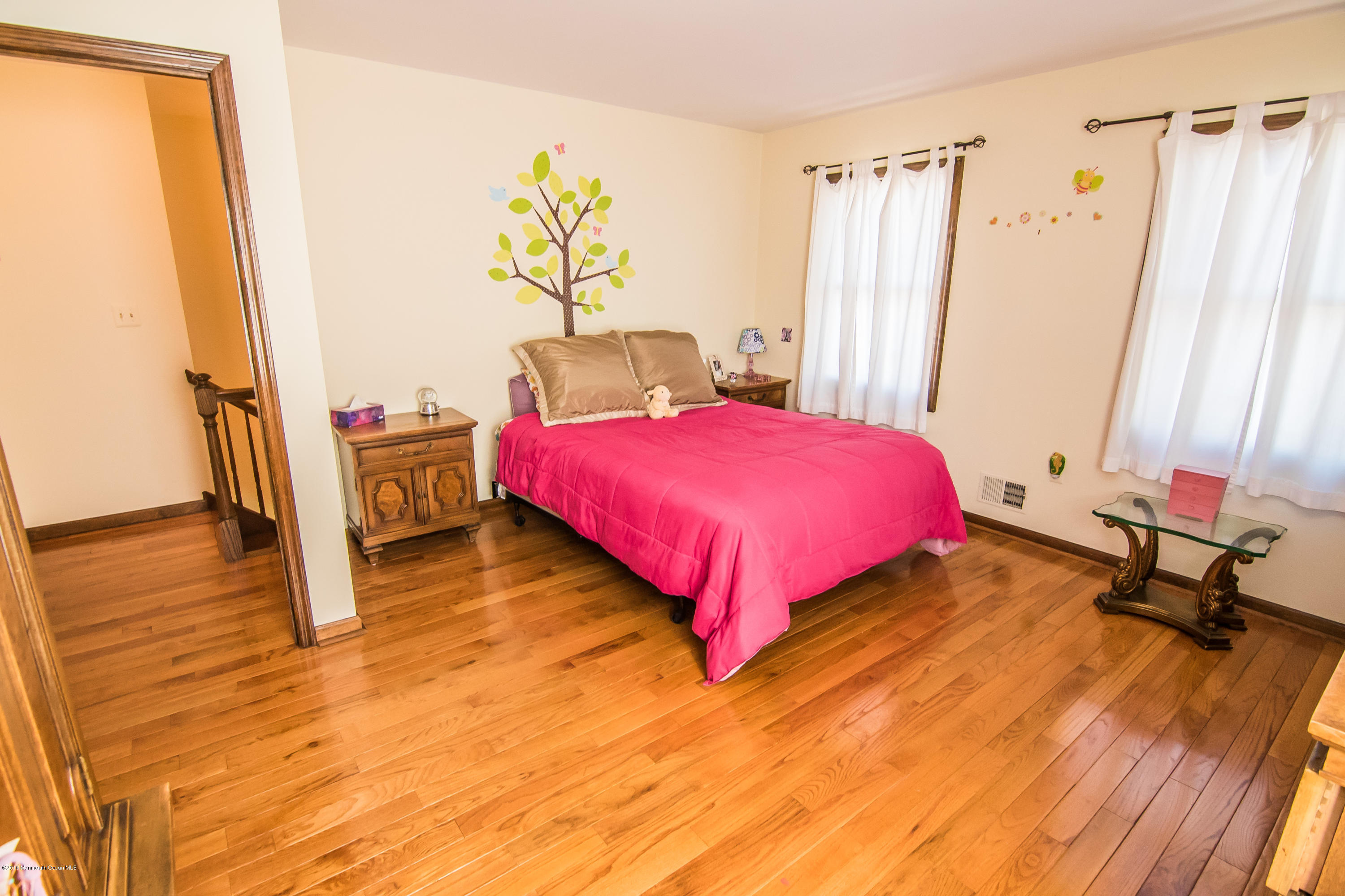 20 Pinckney Road, Unit A1 Red Bank, NJ 07701 - Photo 18 of 25 a bedroom with a bed and wooden floor