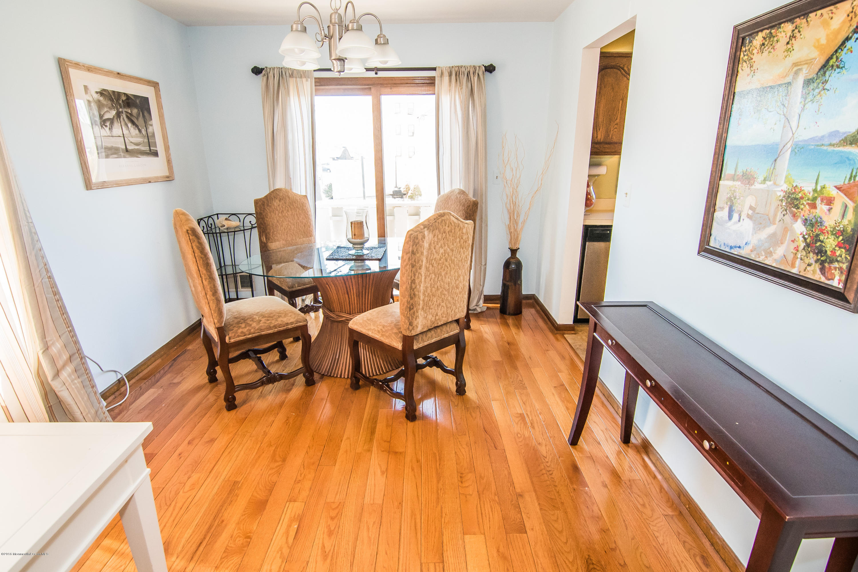20 Pinckney Road, Unit A1 Red Bank, NJ 07701 - Photo 5 of 25 a living room with furniture and a large window