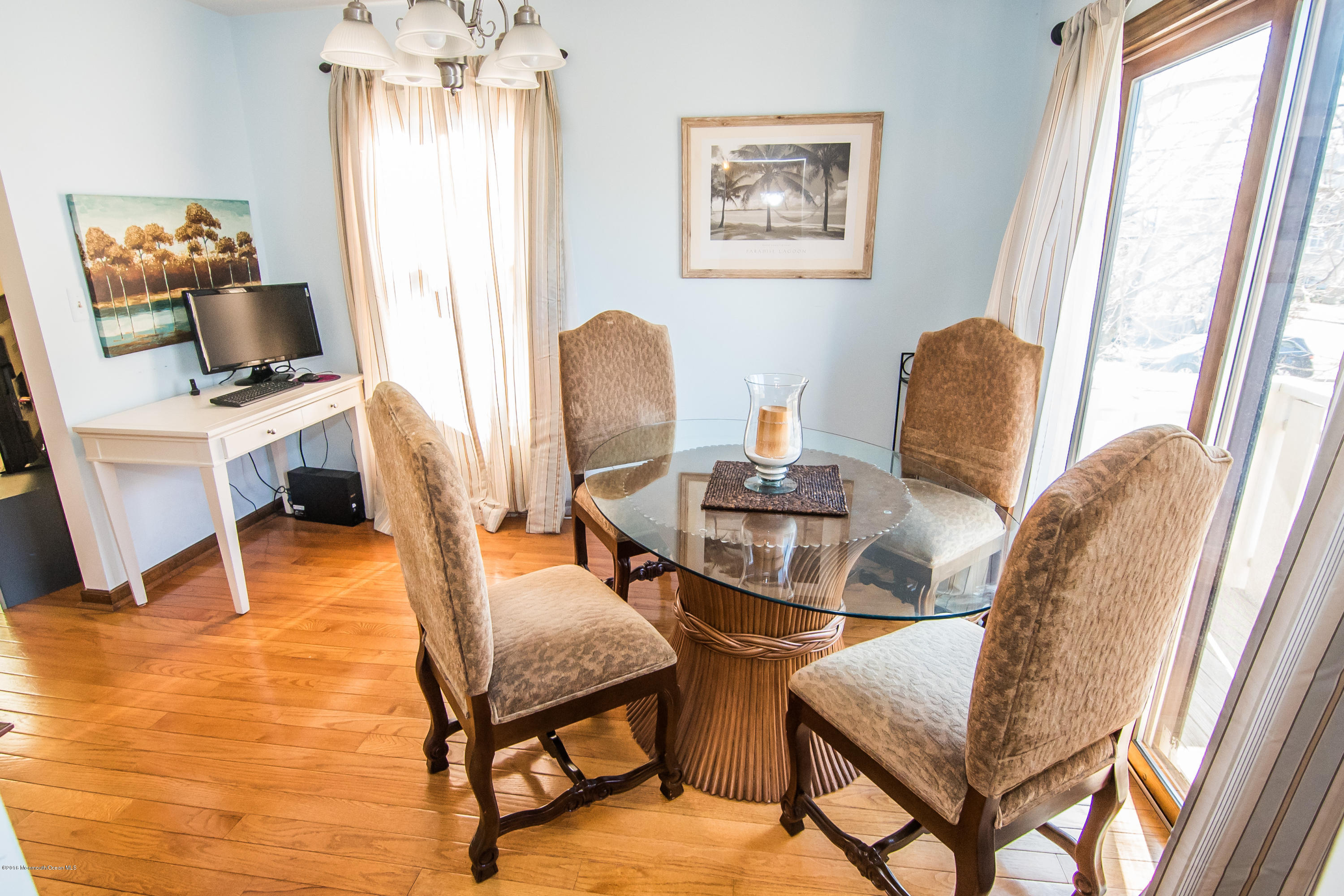 20 Pinckney Road, Unit A1 Red Bank, NJ 07701 - Photo 6 of 25 a view of a dining room with furniture a chandelier and wooden floor