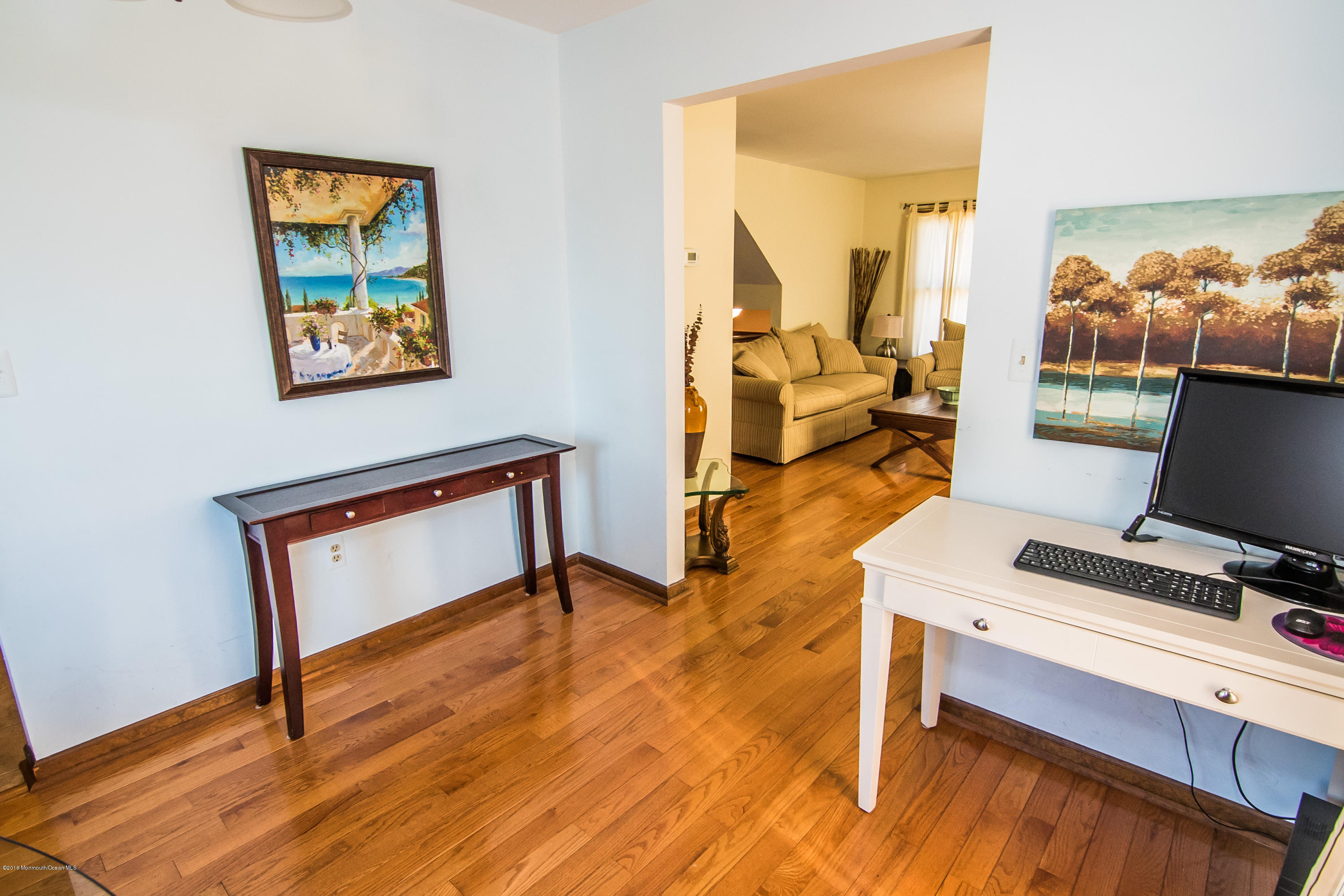 20 Pinckney Road, Unit A1 Red Bank, NJ 07701 - Photo 7 of 25 a view of a workspace with furniture and a bedroom