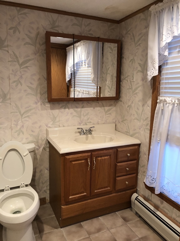 184 Middle Street, Unit 2 Braintree, MA 02184 - Photo 4 of 14 a bathroom with a sink toilet and mirror