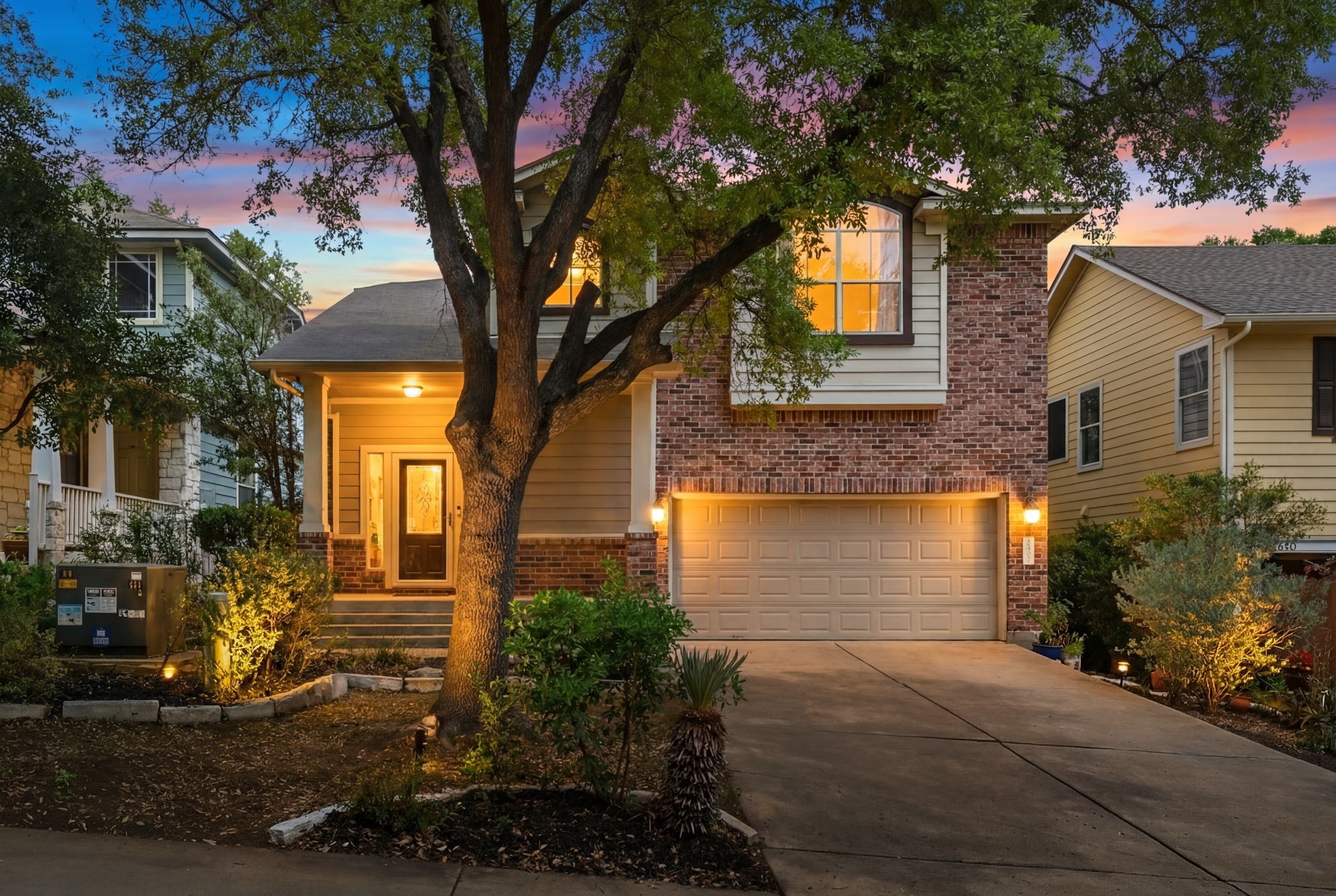2402 Keepsake Drive Austin, TX 78745 - Photo 1 of 1 a front view of a house with a yard and garage