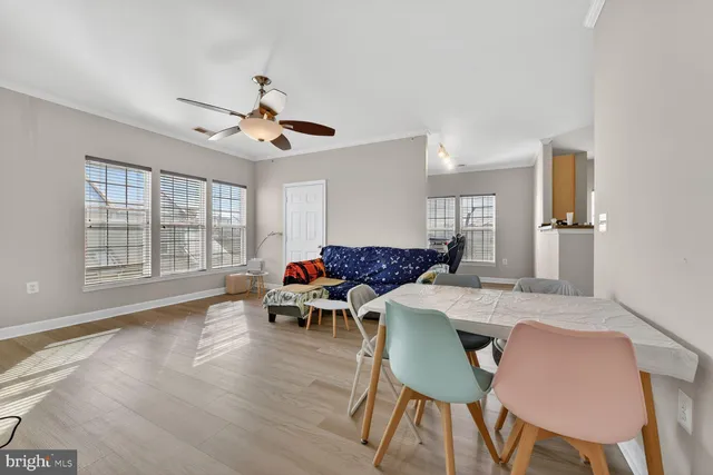 a view of a dining room with furniture window and wooden floor