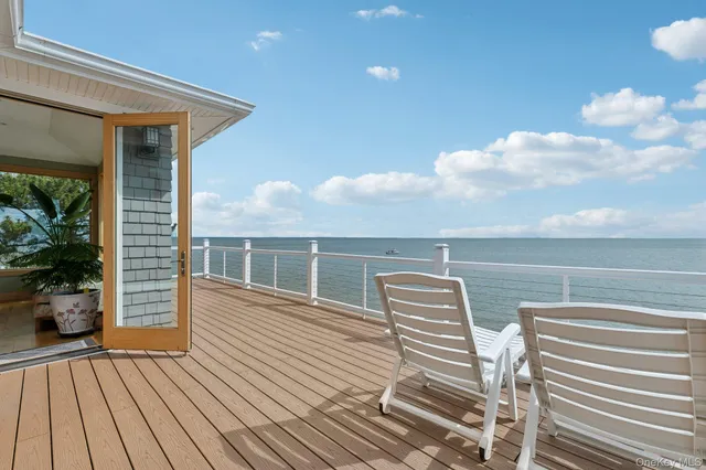 a balcony view with a outdoor seating