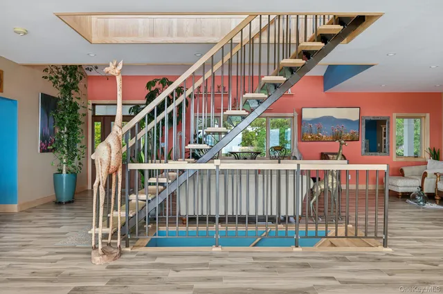 a view of entryway dining room and hall with wooden floor
