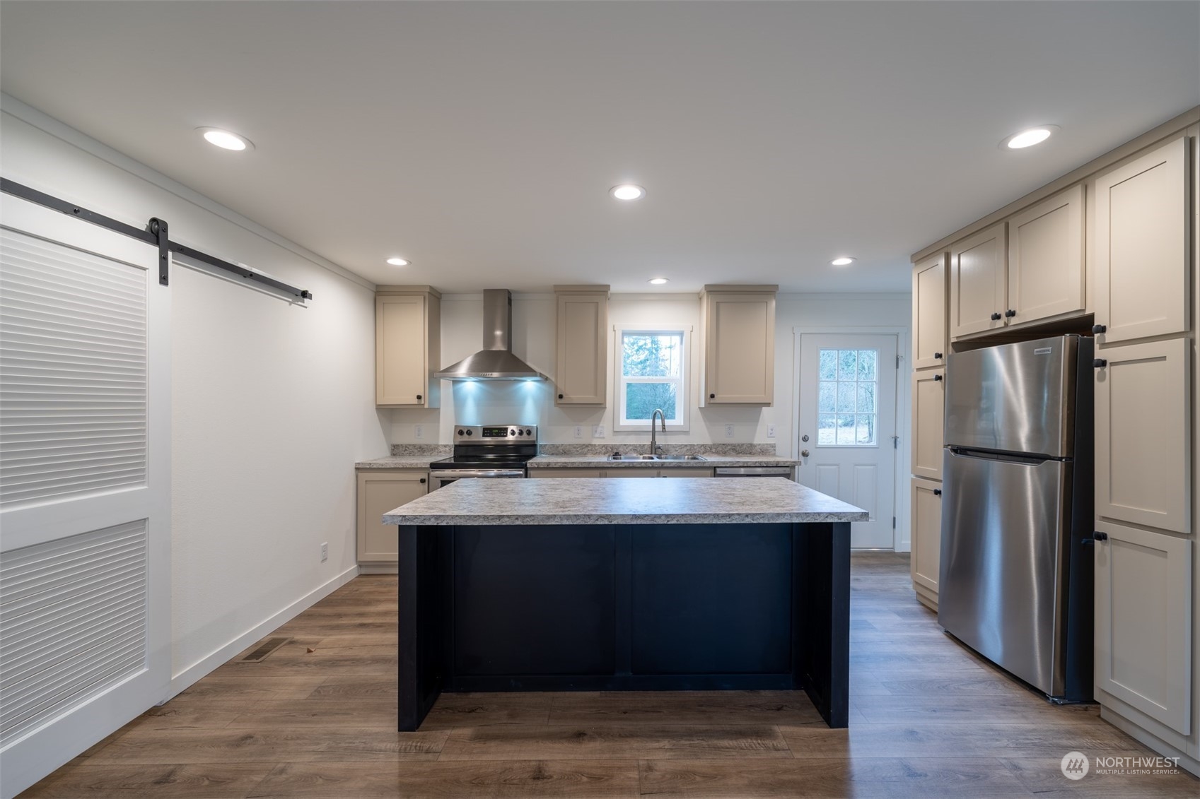 789 Chandler Road Chehalis, WA 98532 - Photo 4 of 17 a kitchen with kitchen island stainless steel appliances a sink and refrigerator