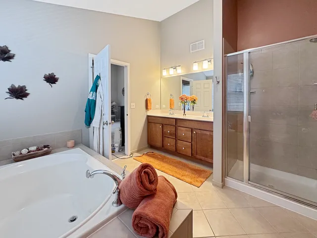 a bathroom with a tub and shower