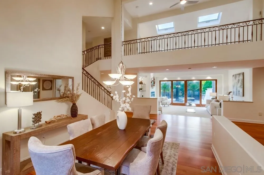 16052 Country Day Road Poway, CA 92064 - Photo 29 of 75 a living room with furniture a large window and wooden floor