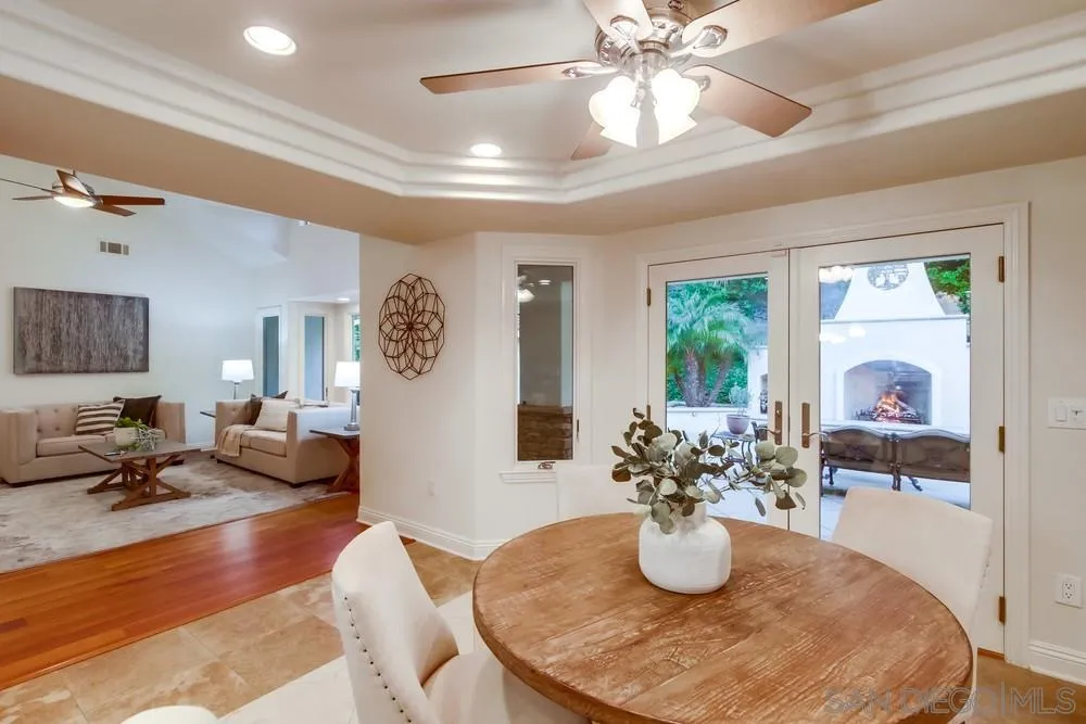 16052 Country Day Road Poway, CA 92064 - Photo 36 of 75 a dining room with wooden floor and chandelier