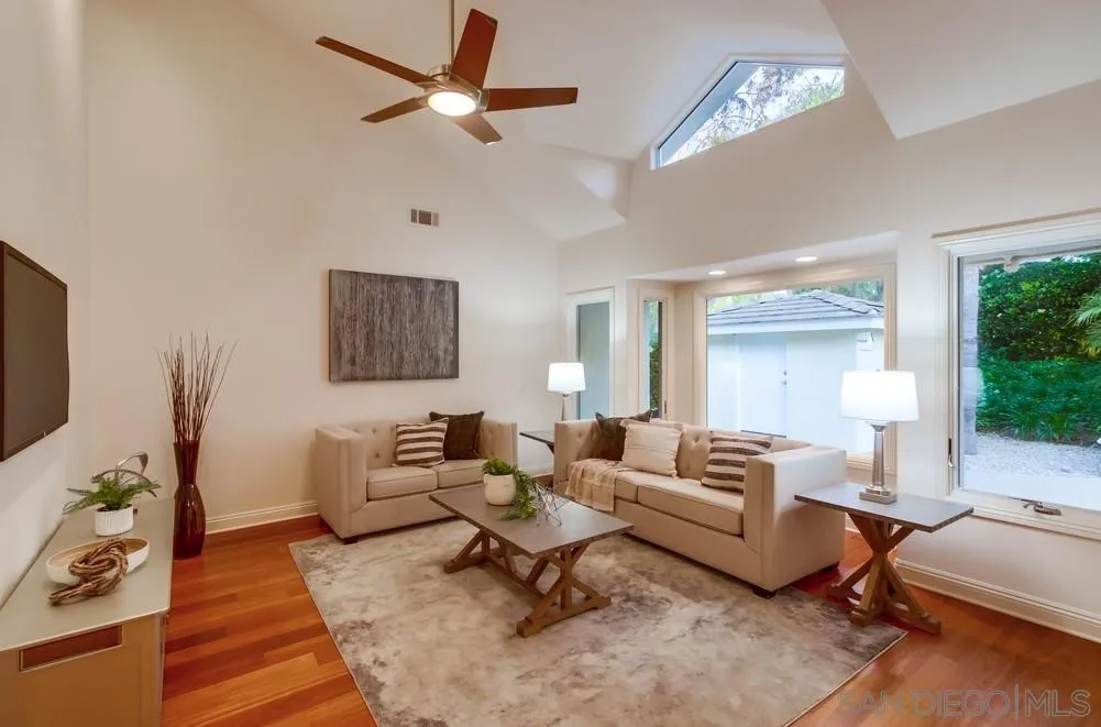 16052 Country Day Road Poway, CA 92064 - Photo 37 of 75 a living room with furniture a rug and a chandelier
