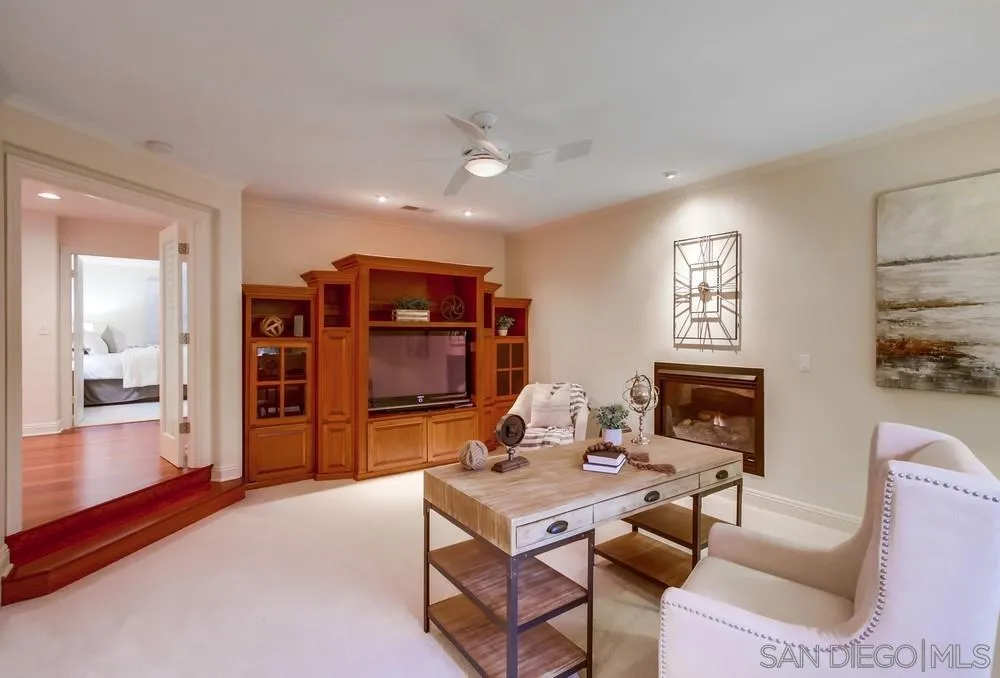 16052 Country Day Road Poway, CA 92064 - Photo 40 of 75 a living room with furniture a flat screen tv and a fireplace