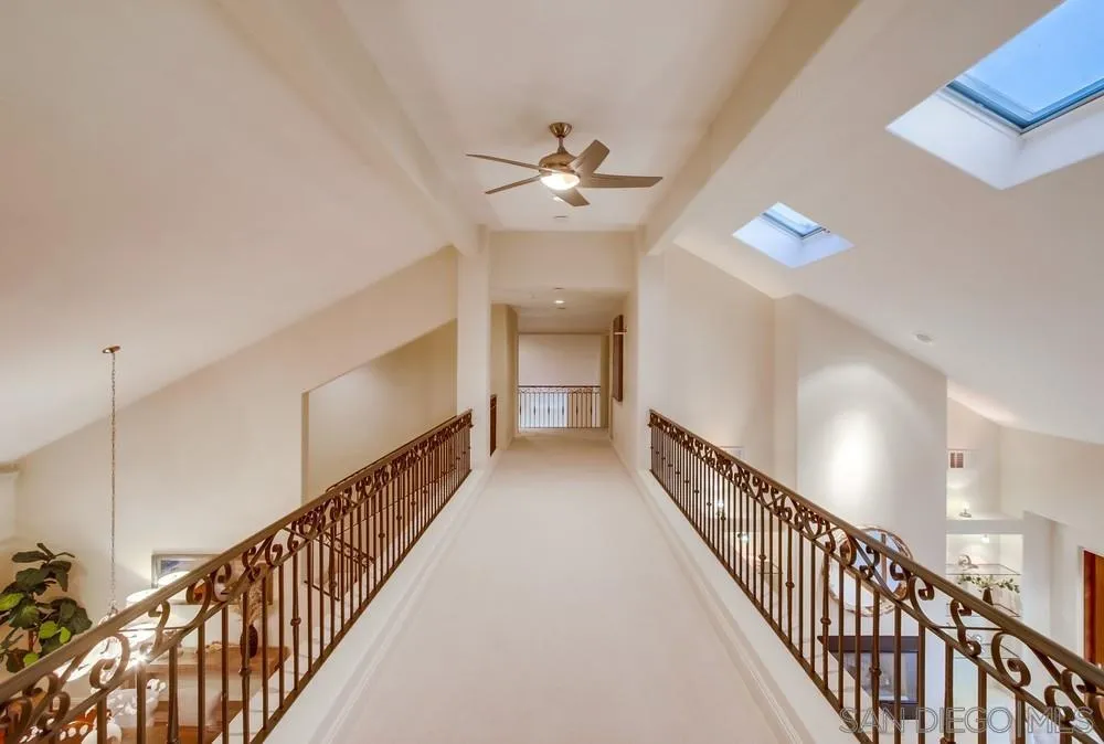 16052 Country Day Road Poway, CA 92064 - Photo 45 of 75 a view of a hallway with wooden floor and staircase