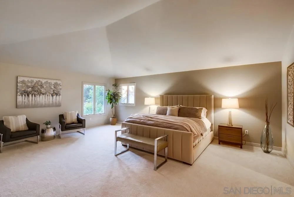 16052 Country Day Road Poway, CA 92064 - Photo 46 of 75 a spacious bedroom with a bed couch table and a window