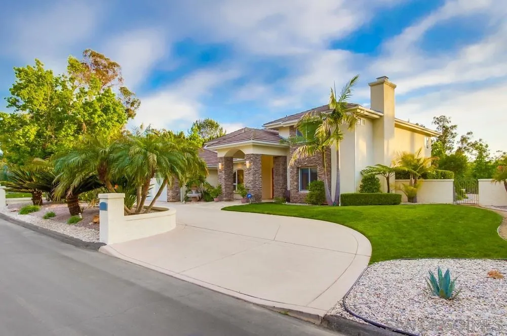 16052 Country Day Road Poway, CA 92064 - Photo 53 of 75 a front view of a house with a yard and garage