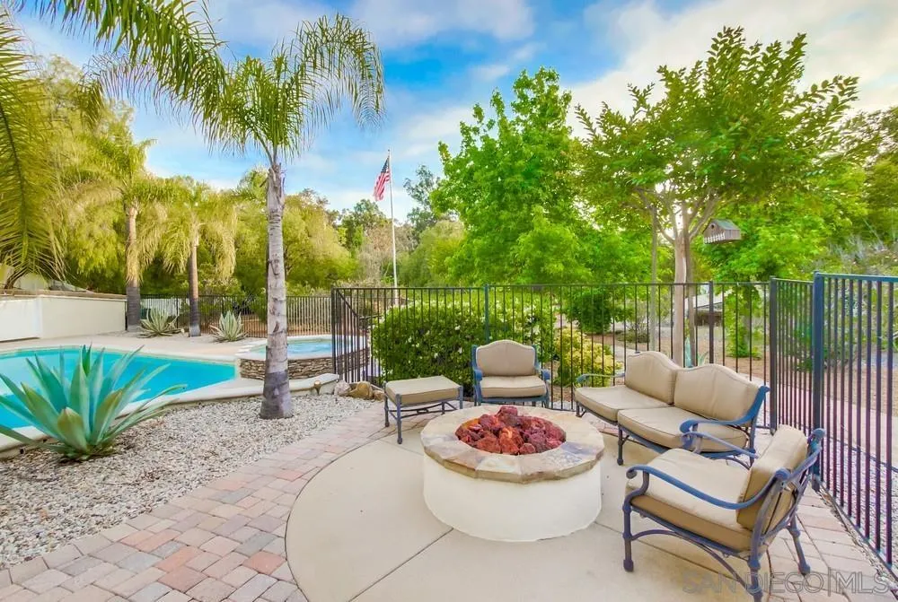 16052 Country Day Road Poway, CA 92064 - Photo 60 of 75 a outdoor living space with furniture and a potted plant