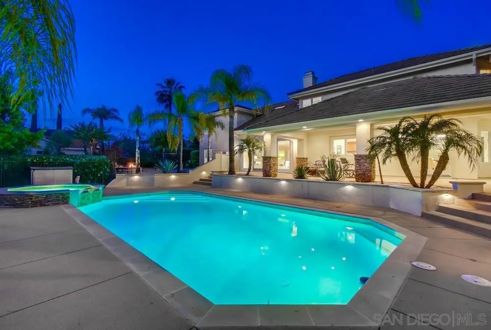 16052 Country Day Road Poway, CA 92064 - Photo 7 of 75 a view of a swimming pool with an outdoor space and seating area