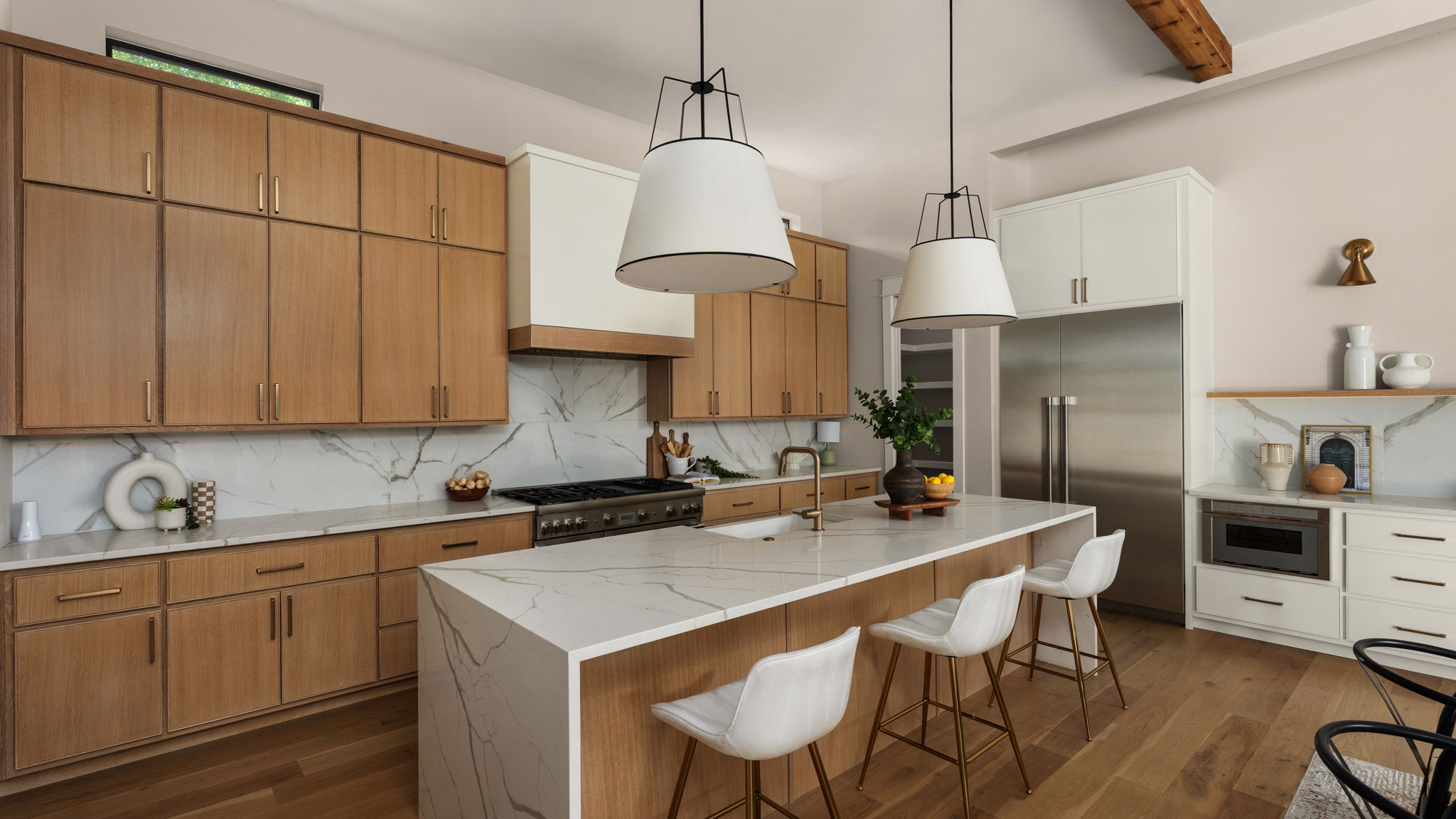 1909 West 40th Street Austin, TX 78731 - Photo 12 of 40 Sleek finishes and thoughtful storage make this kitchen as functional as it is beautiful.