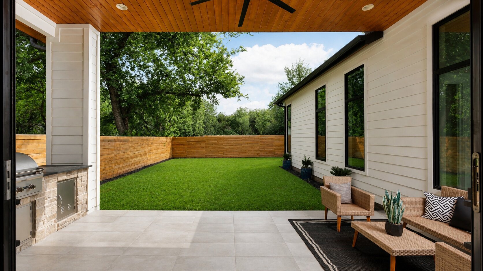 1909 West 40th Street Austin, TX 78731 - Photo 39 of 40 The spacious covered patio overlooks the private fenced backyard shaded by mature trees.