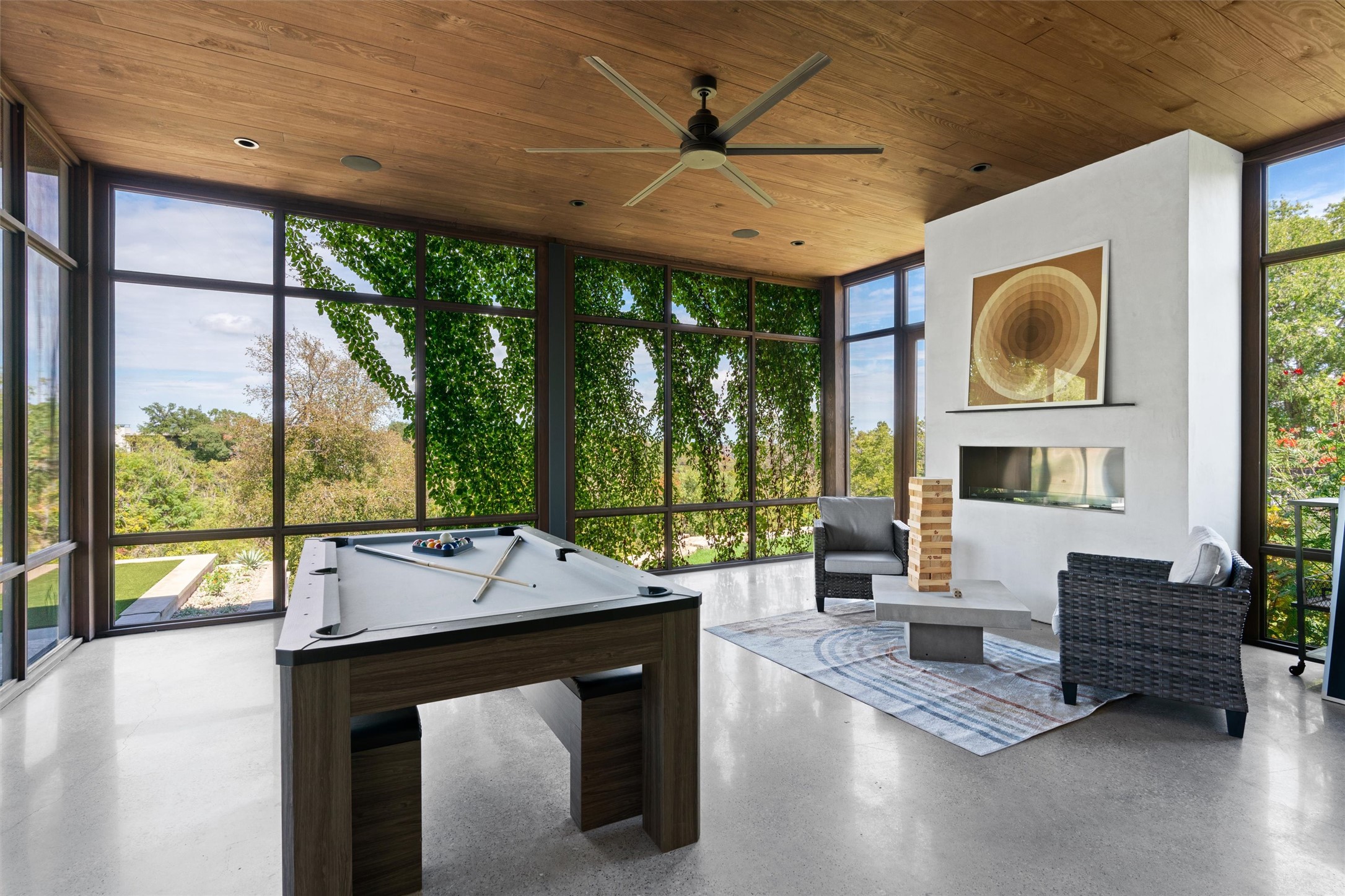 1500 The High Road Austin, TX 78746 - Photo 14 of 40 Expansive screened in porch with a fireplace, and a ceiling fan