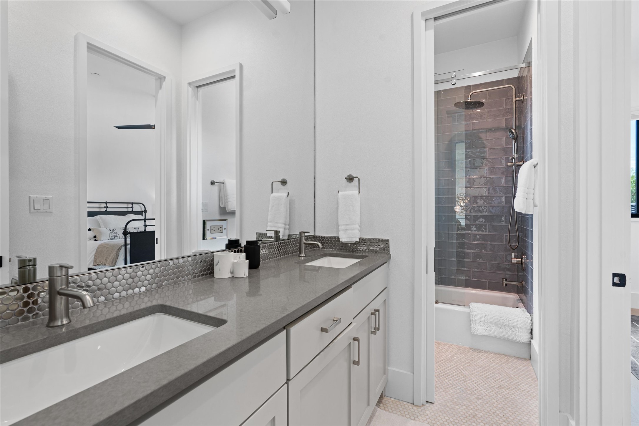 1500 The High Road Austin, TX 78746 - Photo 27 of 40 Dual vanity with undermount sinks, gray countertop, and brushed nickel fixtures