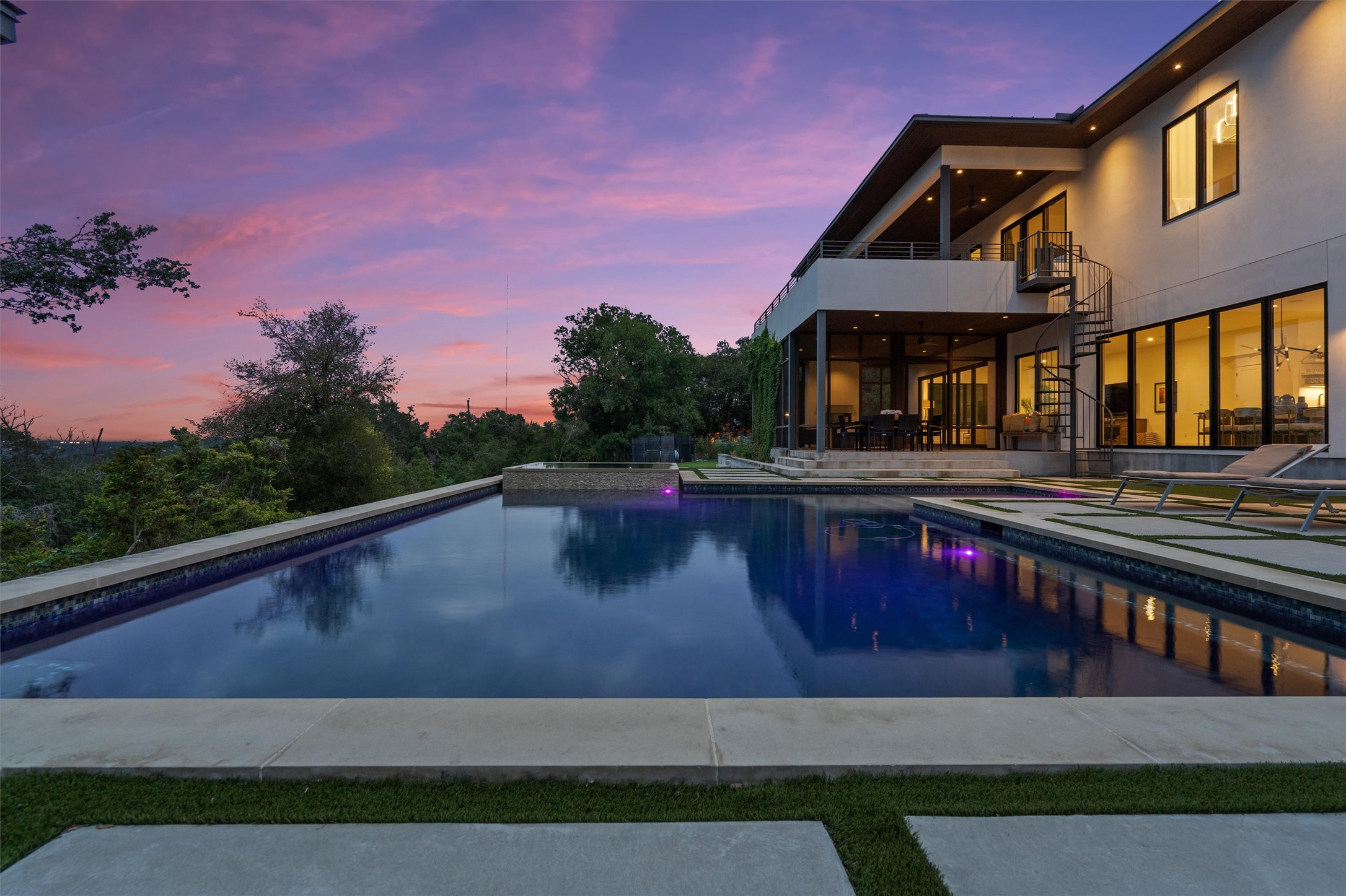 1500 The High Road Austin, TX 78746 - Photo 36 of 40 Expansive infinity-edge pool with a surrounding concrete deck and integrated spa