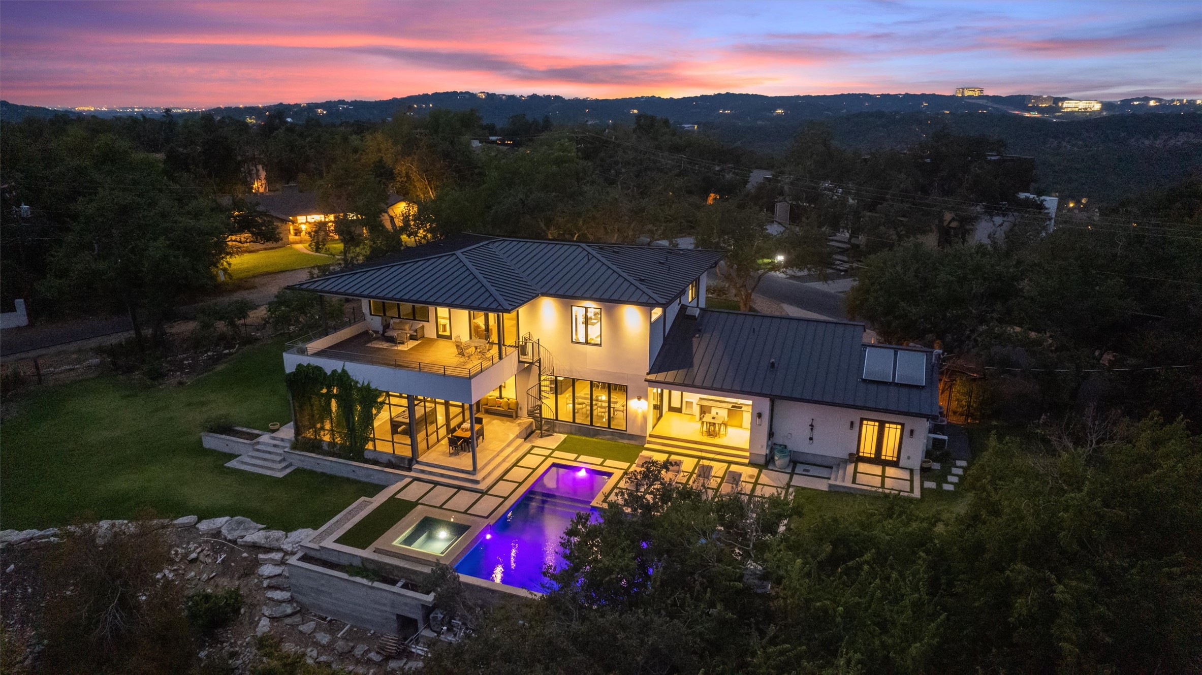 1500 The High Road Austin, TX 78746 - Photo 38 of 40 Contemporary residence featuring multiple levels, an outdoor pool with a spa, extensive glass paneling, and a second-story balcony
