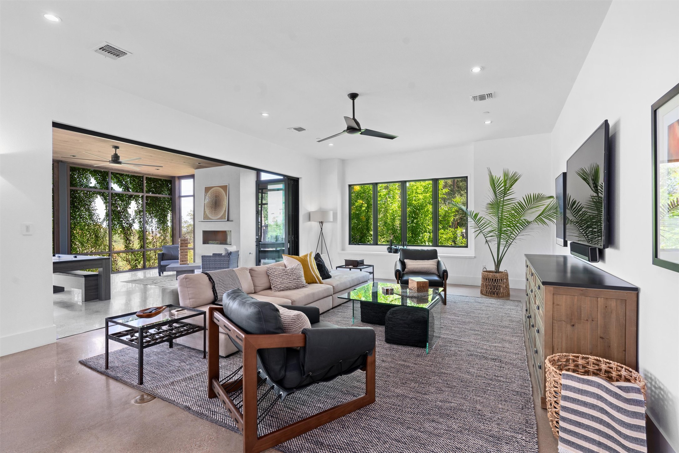 1500 The High Road Austin, TX 78746 - Photo 4 of 40 Spacious living area opens up to expansive screened in porch