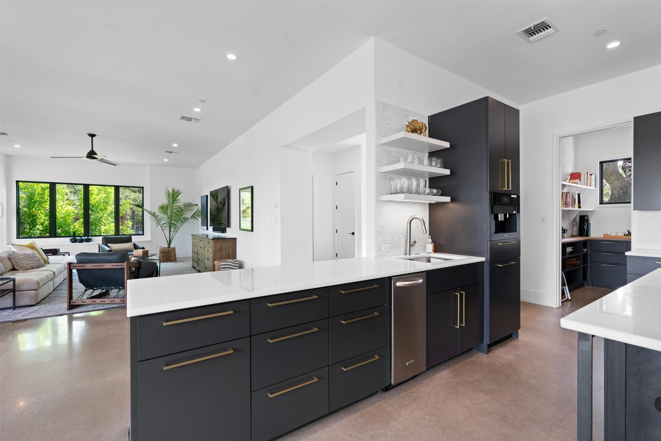 1500 The High Road Austin, TX 78746 - Photo 8 of 40 Kitchen with honed marble countertops, built in ince-maker, Miele espresso maker and peak into Butler's pantry