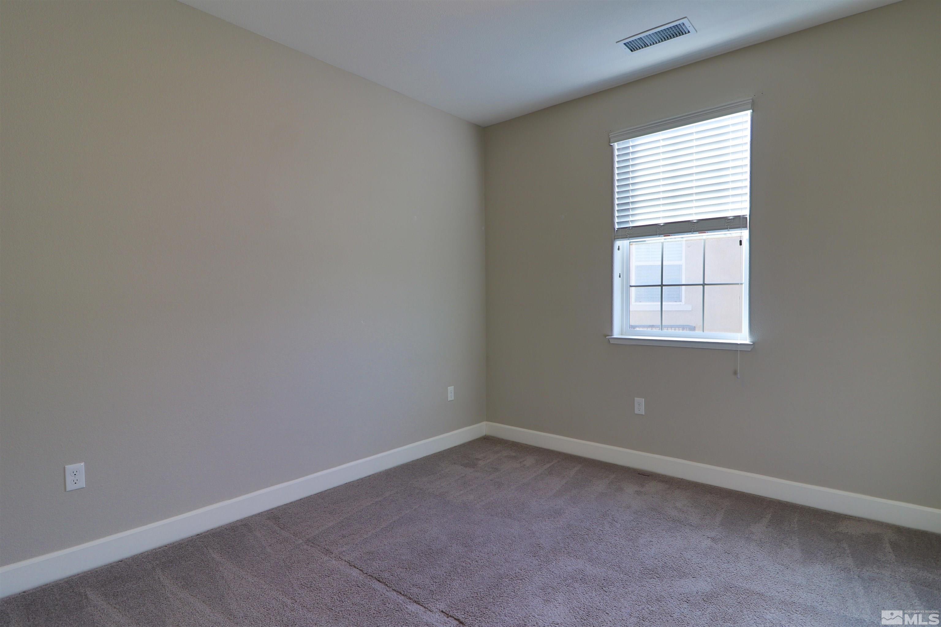 1920 Dark Horse Road, Unit C Reno, NV 89521 - Photo 16 of 26 an empty room with a window