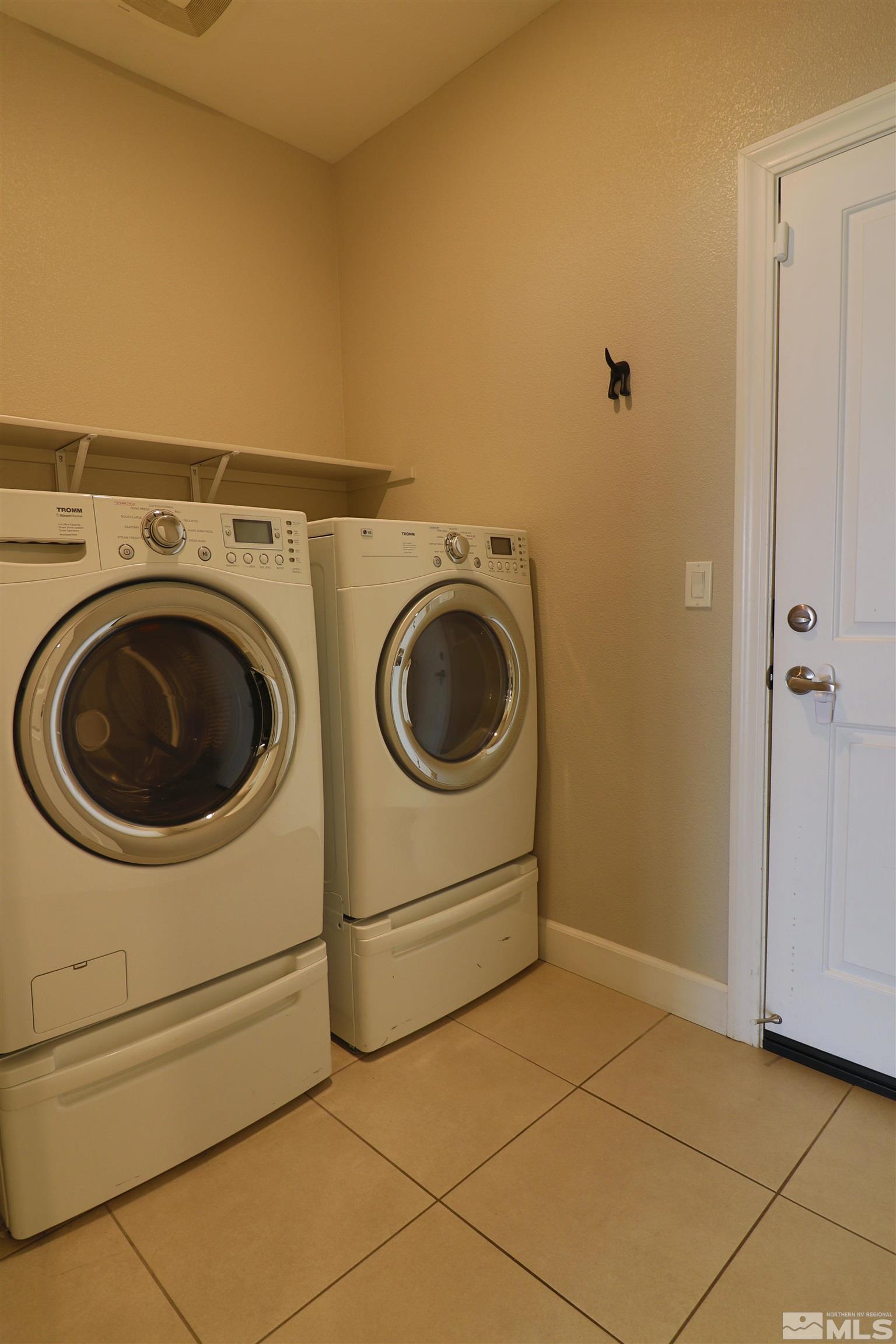 1920 Dark Horse Road, Unit C Reno, NV 89521 - Photo 18 of 26 a utility room with dryer and washer