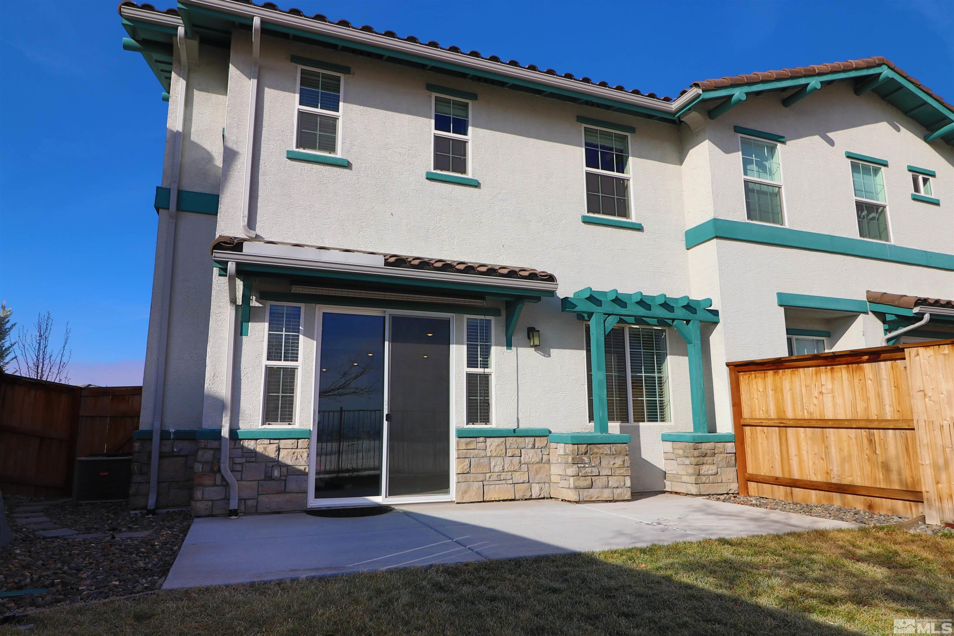 1920 Dark Horse Road, Unit C Reno, NV 89521 - Photo 19 of 26 a view of a house with wooden walls and a yard