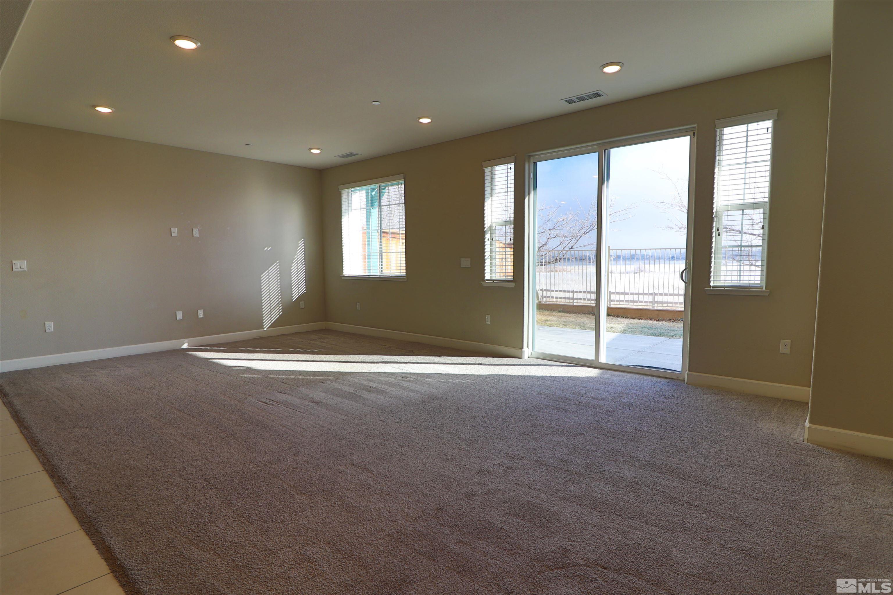 1920 Dark Horse Road, Unit C Reno, NV 89521 - Photo 2 of 26 a view of an empty room with a window