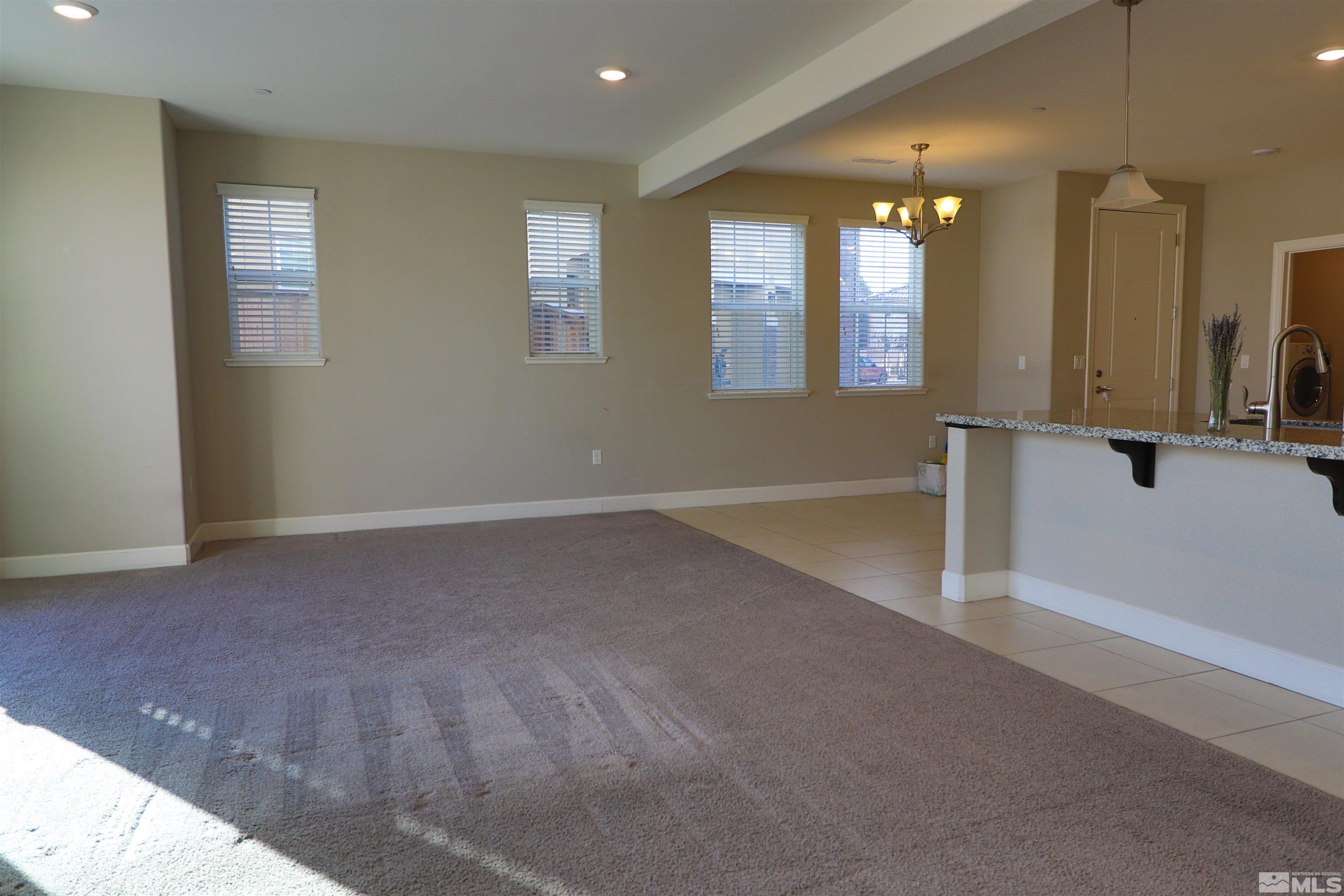 1920 Dark Horse Road, Unit C Reno, NV 89521 - Photo 4 of 26 a view of an empty room with window and bathroom