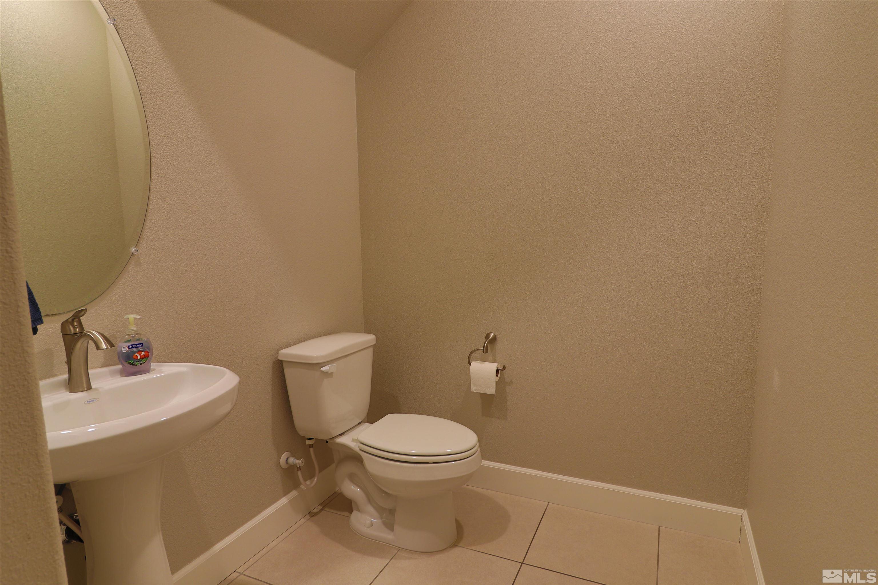 1920 Dark Horse Road, Unit C Reno, NV 89521 - Photo 9 of 26 a bathroom with a toilet and a sink