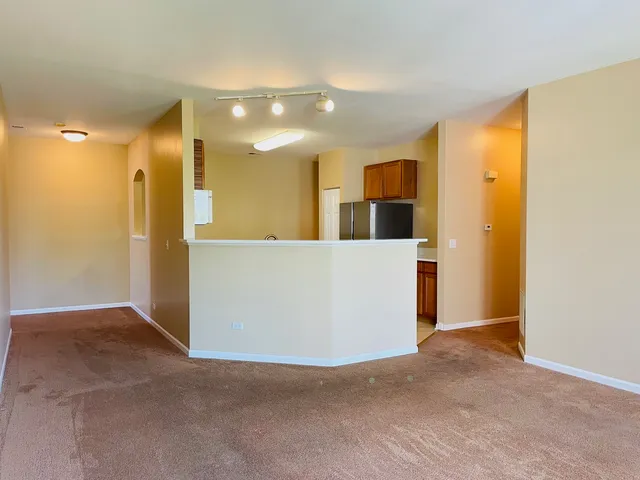 a kitchen with stainless steel appliances a stove a sink and a microwave