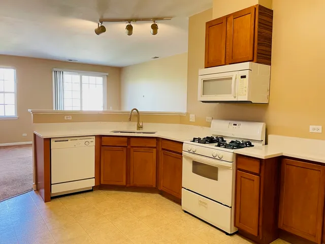 a kitchen with a stove and a sink