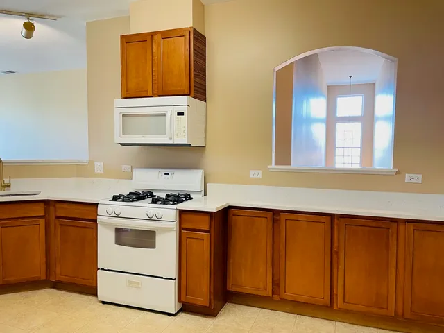 a view of hallway with cabinets