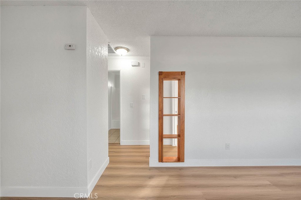 22133 Thunderbird Road Apple Valley, CA 92307 - Photo 12 of 29 a view of a livingroom from a hallway