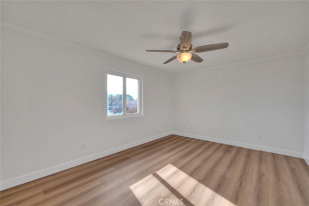 22133 Thunderbird Road Apple Valley, CA 92307 - Photo 13 of 29 wooden floor in an empty room with a window