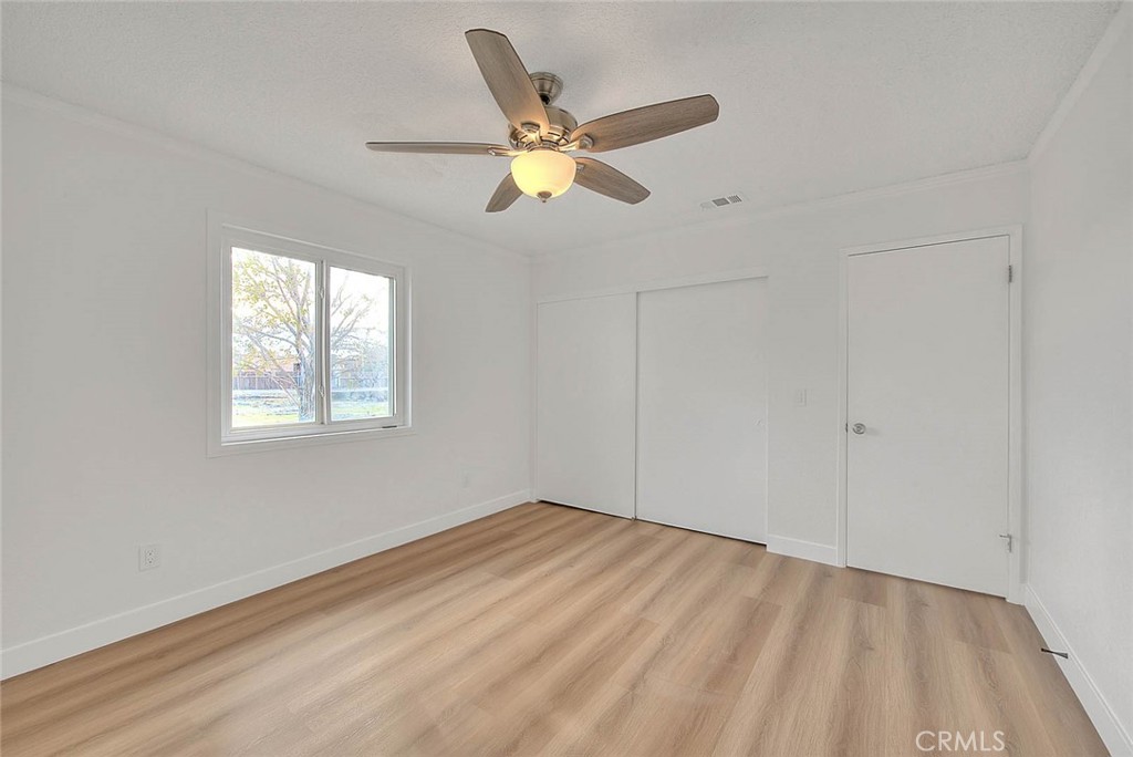 22133 Thunderbird Road Apple Valley, CA 92307 - Photo 16 of 29 a view of empty room with ceiling fan