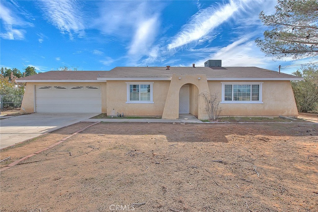 22133 Thunderbird Road Apple Valley, CA 92307 - Photo 2 of 29 front view of house with a yard