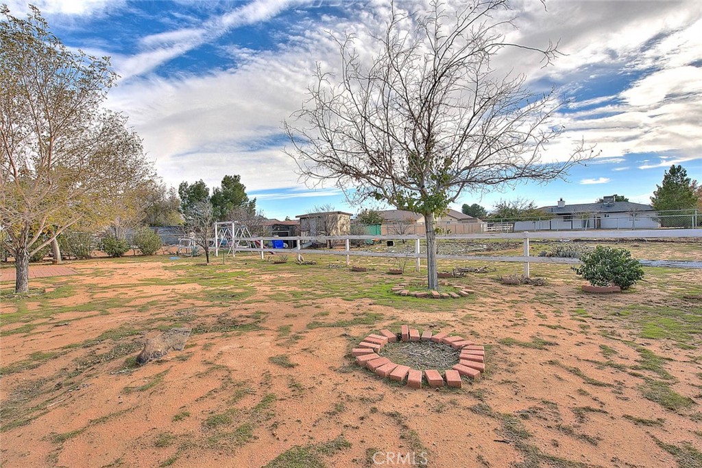 22133 Thunderbird Road Apple Valley, CA 92307 - Photo 23 of 29 a view of yard with swimming pool and green space
