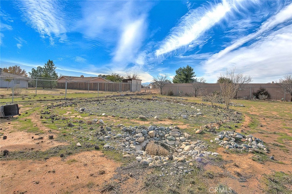 22133 Thunderbird Road Apple Valley, CA 92307 - Photo 27 of 29 a view of a big yard with a house