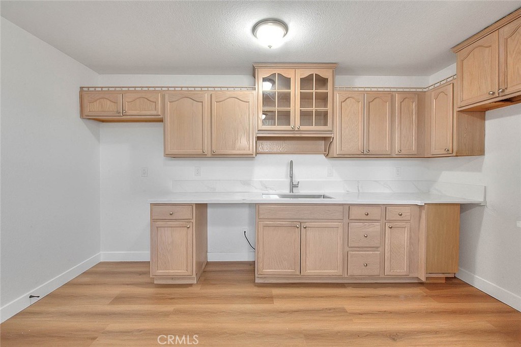 22133 Thunderbird Road Apple Valley, CA 92307 - Photo 5 of 29 a kitchen with stainless steel appliances granite countertop a sink and cabinets