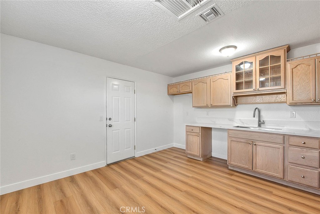 22133 Thunderbird Road Apple Valley, CA 92307 - Photo 6 of 29 a bathroom with a sink and a mirror
