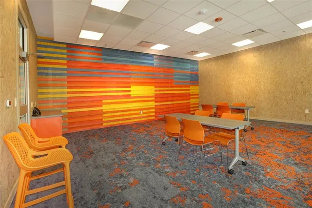 a outdoor living space with furniture and a flat screen tv